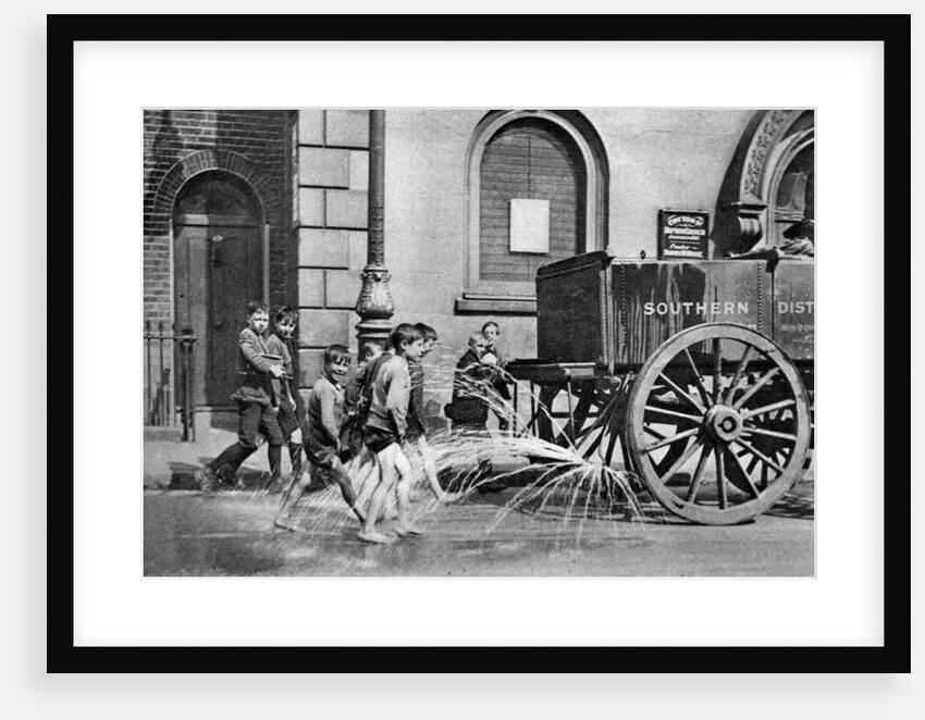 Boys following the Poplar Borough Council water cart, London by Anonymous