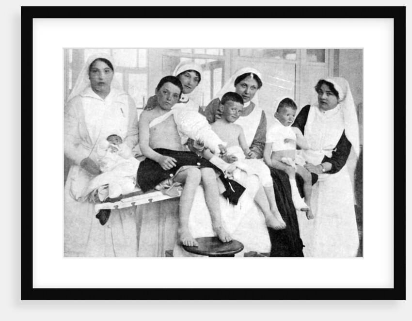 Wounded children from Ypres with nurses at La Panne, Belgium, First World War by Anonymous