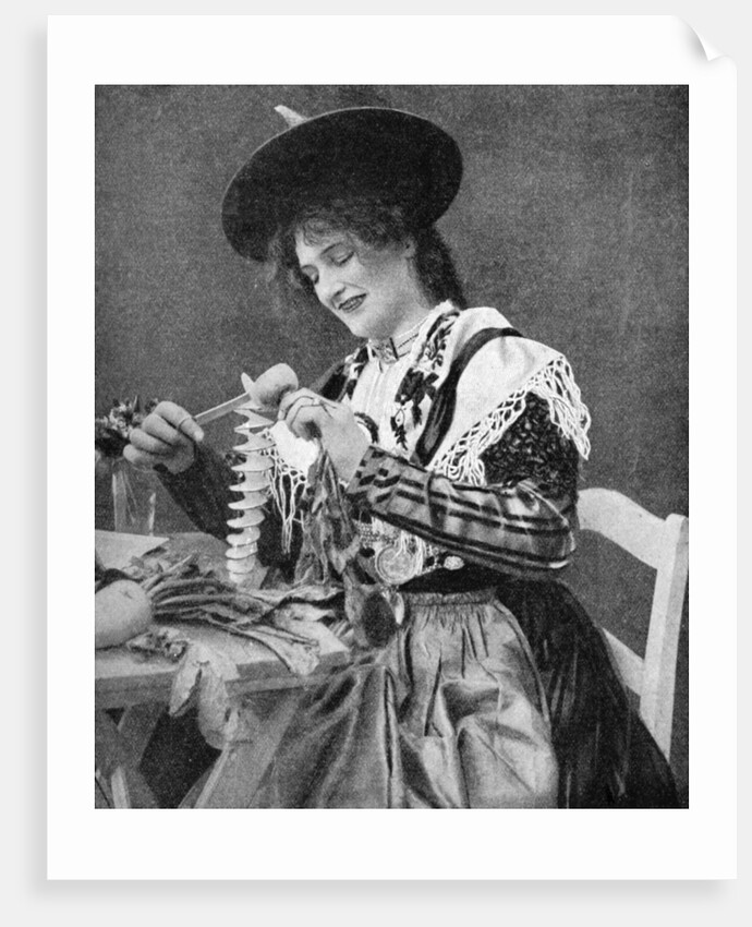 A woman creatively peeling a potato by Georg Haeckel