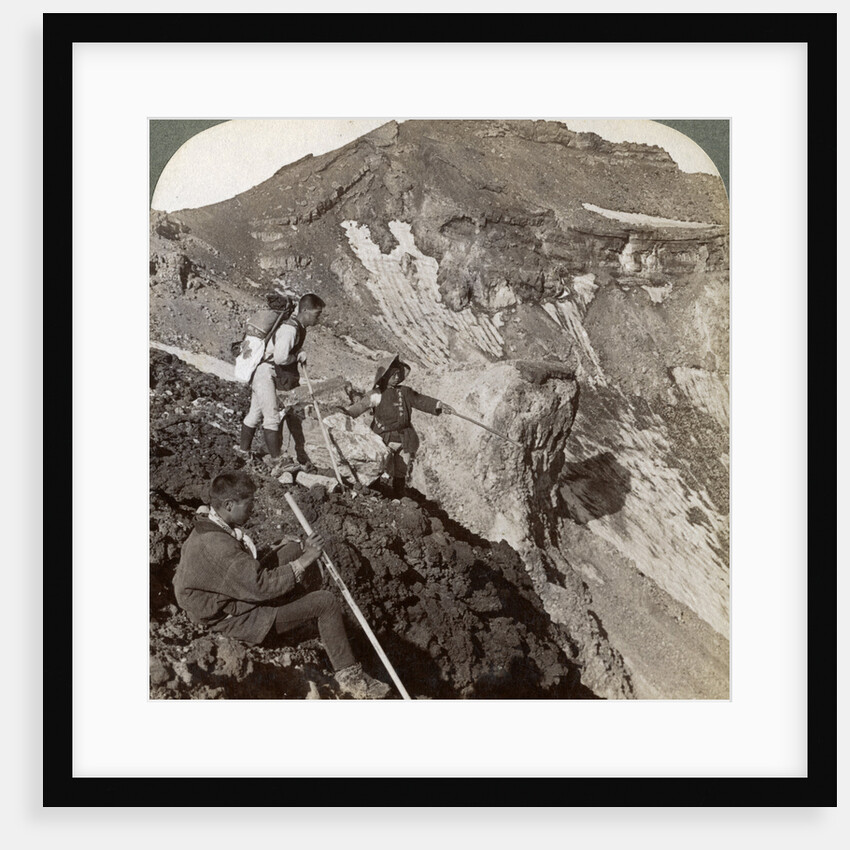 Peering from the lava encrusted rim down into Mount Fuji's (Fujiyama's) crater, Japan by Underwood & Underwood