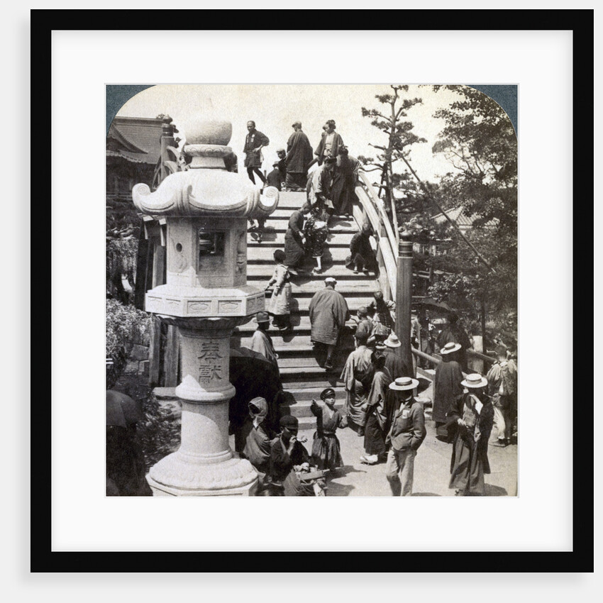Worshippers crossing the semi-circular bridge to Kameido Temple beyond, looking north, Tokyo, Japan by Underwood & Underwood