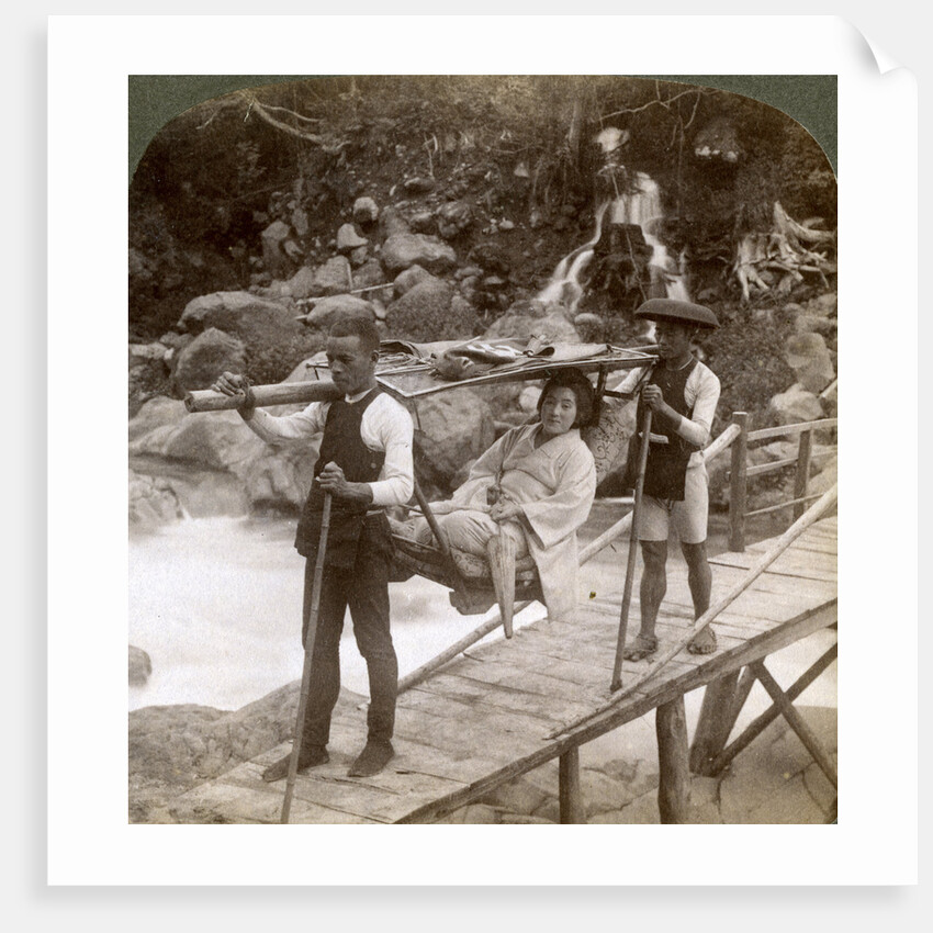 Japanese woman in a yamakago (mountain chair) crossing the torrential Daiya river near Nikko, Japan by Underwood & Underwood