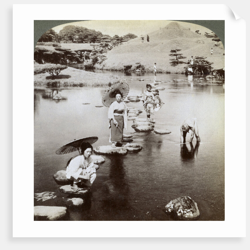 Women crossing the lake on stepping stones, Suizen-ji Garden, Kumamoto, Japan by Underwood & Underwood