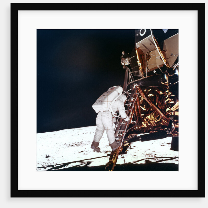 Edwin Buzz Aldrin descends the steps of the Lunar Module ladder to walk on the Moon by NASA