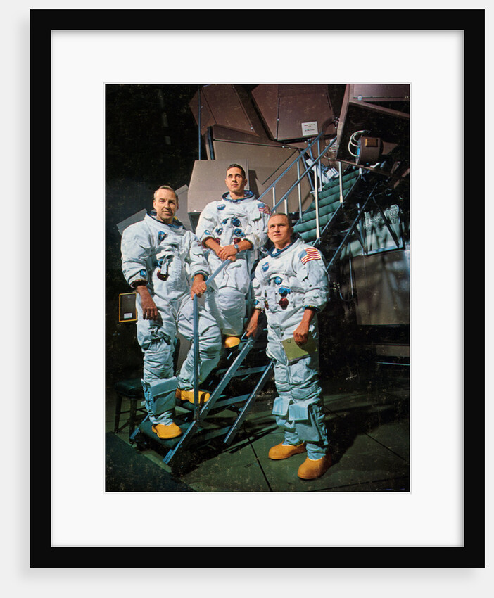The crew of Apollo 8 in front of a simulator by NASA