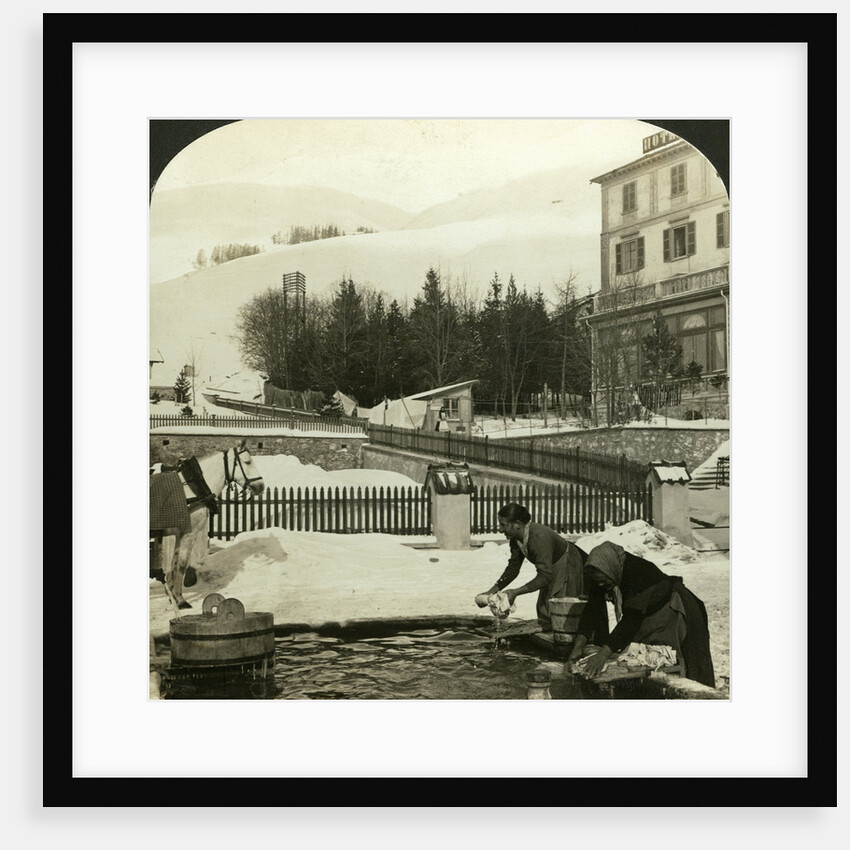 Women washing clothes at the public fountain in midwinter, Zuoz, Switzerland by HC White