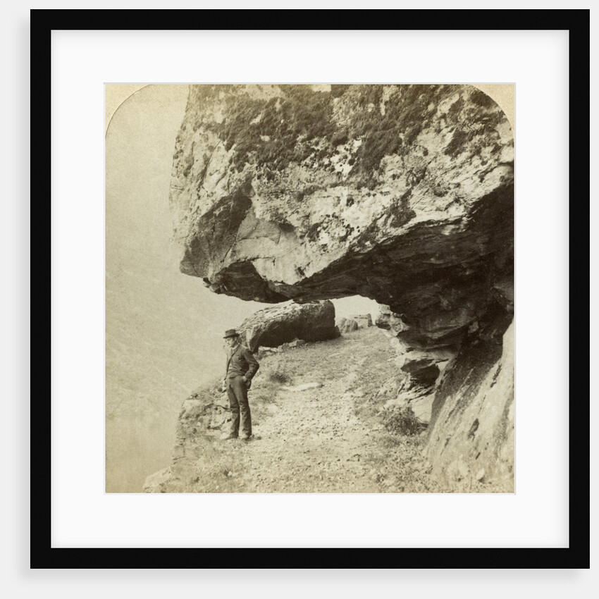 Man on a cliff overlooking Naeroyfjord, Sogne, Norway by Bert Underwood
