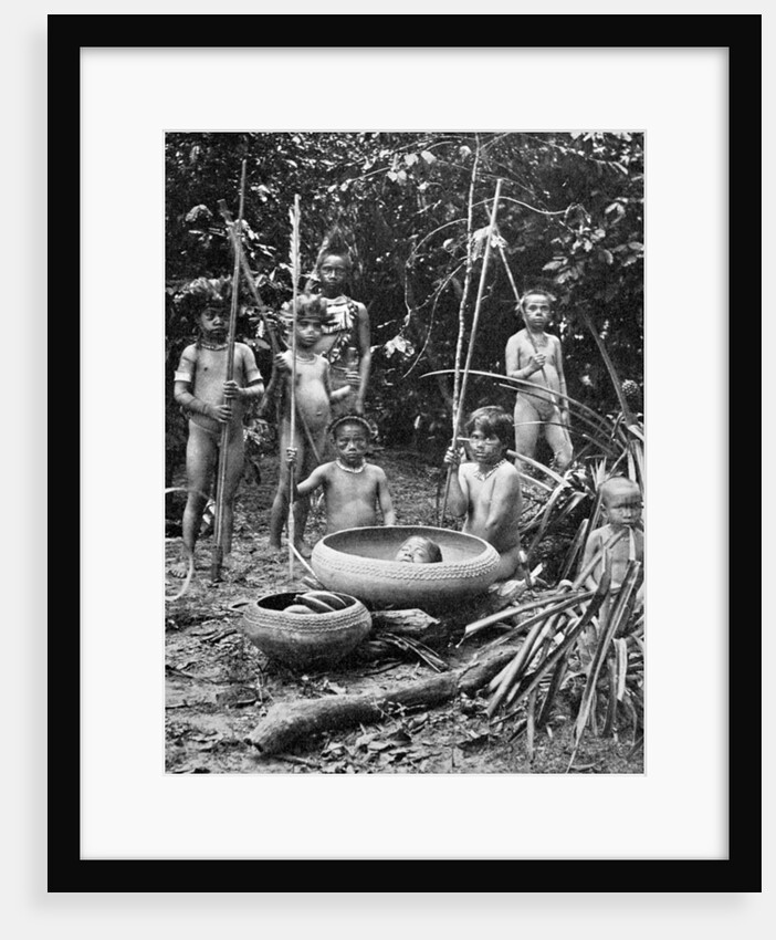 Indians of the Putumayo River with a decapitated head, Amazonia by Anonymous