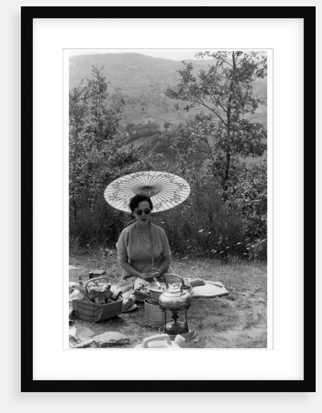 Woman under a parasol having a picnic by Anonymous