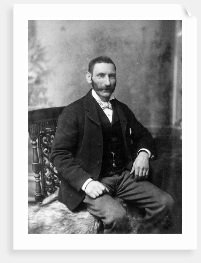 Man sitting in a chair by Theodore Waltenberg