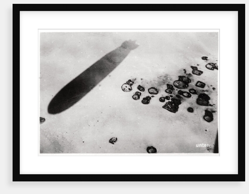 Aerial view of a desert settlement, with a shadow cast by a Zeppelin by Anonymous