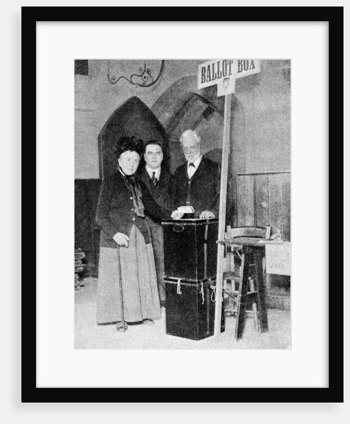 A woman recording her vote at the ballot box by Anonymous
