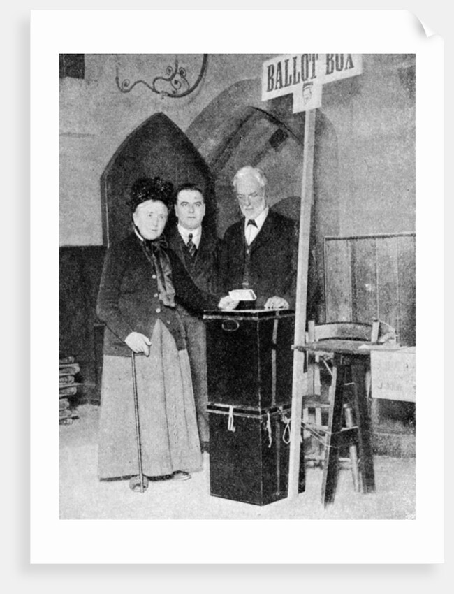 A woman recording her vote at the ballot box by Anonymous