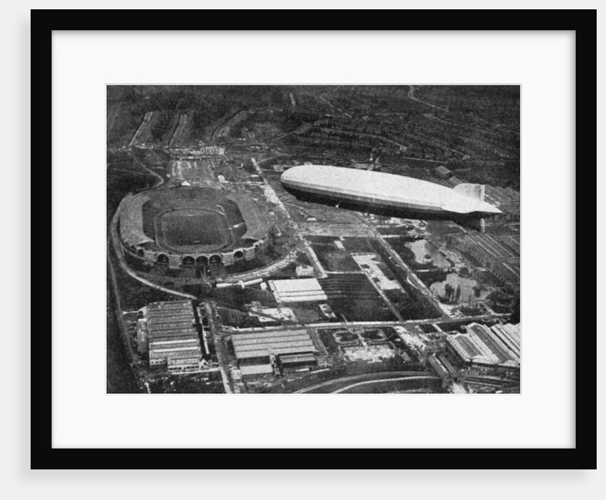 German airship 'Graf Zeppelin' flying over Wembley during the FA Cup Final, London by Central Press