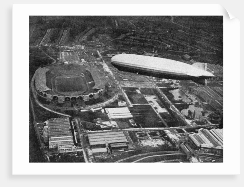 German airship 'Graf Zeppelin' flying over Wembley during the FA Cup Final, London by Central Press