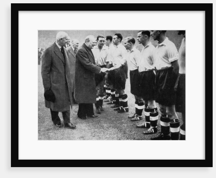 Winston Churchill greets the England football team, Wembley, London, October 1941 by London News Agency