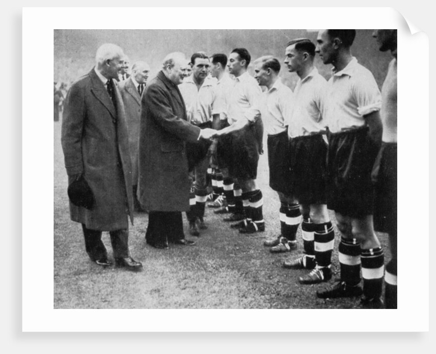 Winston Churchill greets the England football team, Wembley, London, October 1941 by London News Agency