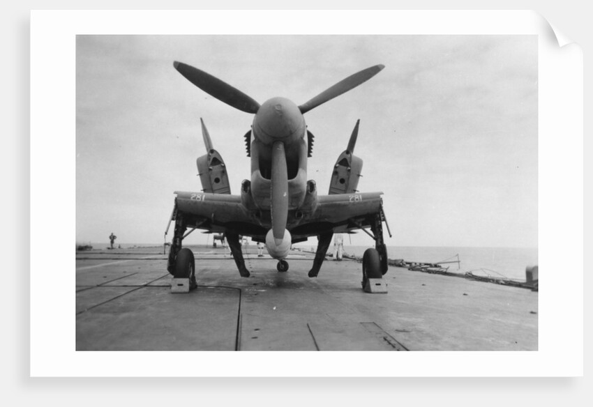 Fairey Firefly aircraft ready to be transported to the hangar lift, HMS Venerable by Anonymous