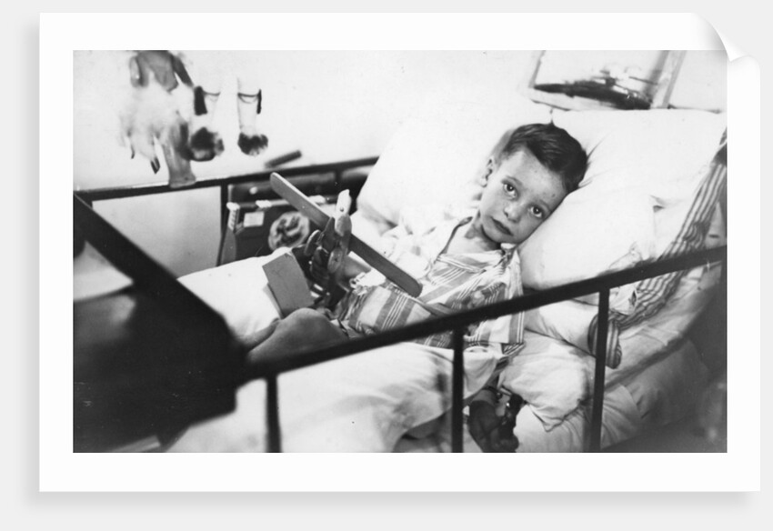 Greek boy from Pylos being nursed in the sick bay of the British battleship HMS Malaya by Anonymous