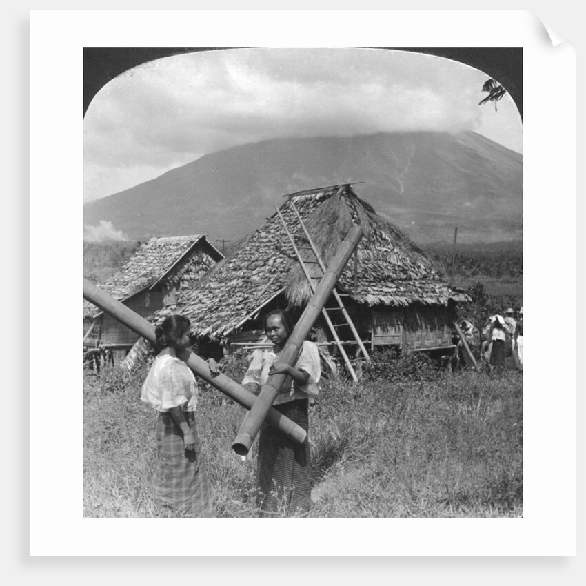 Native girls with their water vessels made from shafts of bamboo, Philippines by HC White