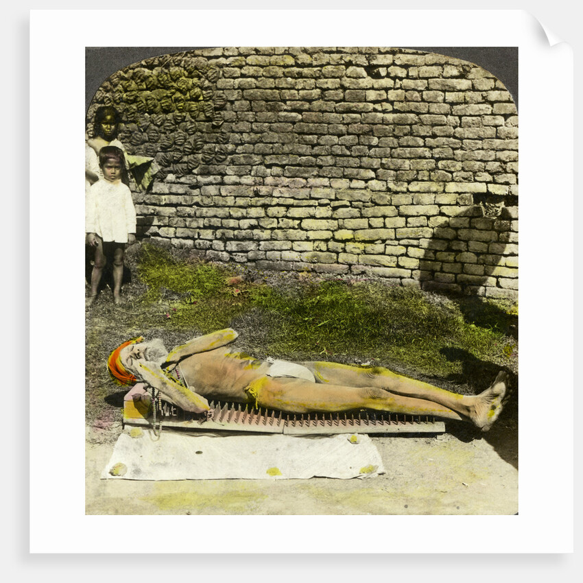 Hindu devotee on a bed of nails near the shrine of Kali, Calcutta, India by Underwood & Underwood