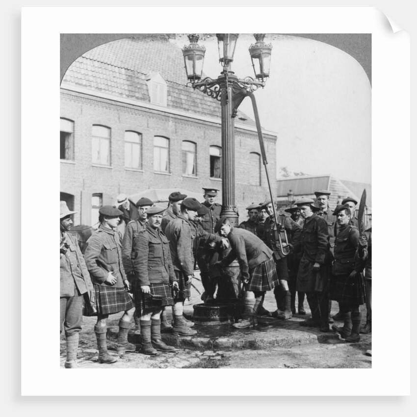 Soldiers filling their water bottles at the town pump La Gorgue, France, World War I by Realistic Travels Publishers