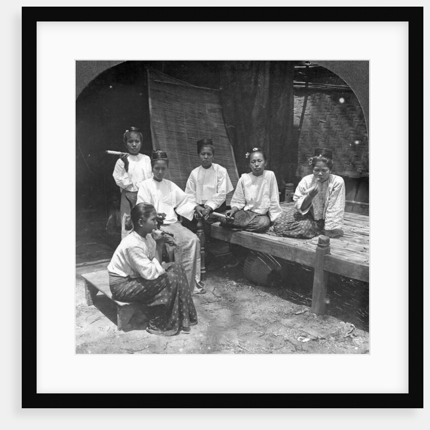 Burmese women smoking outside their home, Mandalay, Burma by Stereo Travel Co