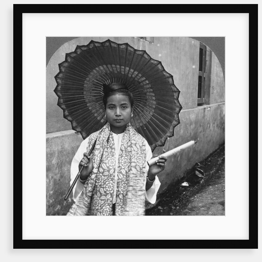 Young Burmese woman holding a huge cigar, Rangoon, Burma by Stereo Travel Co
