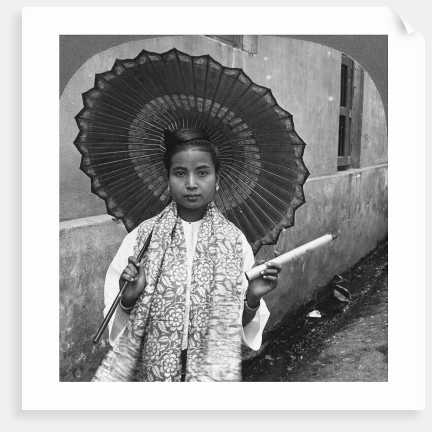 Young Burmese woman holding a huge cigar, Rangoon, Burma by Stereo Travel Co