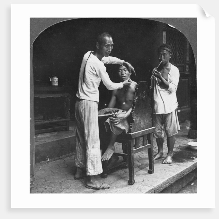 A Chinese barber at Bhamo, Burma by Stereo Travel Co