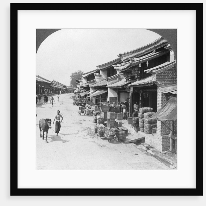 Main business street of the Chinese quarter, Bhamo, Burma by Stereo Travel Co