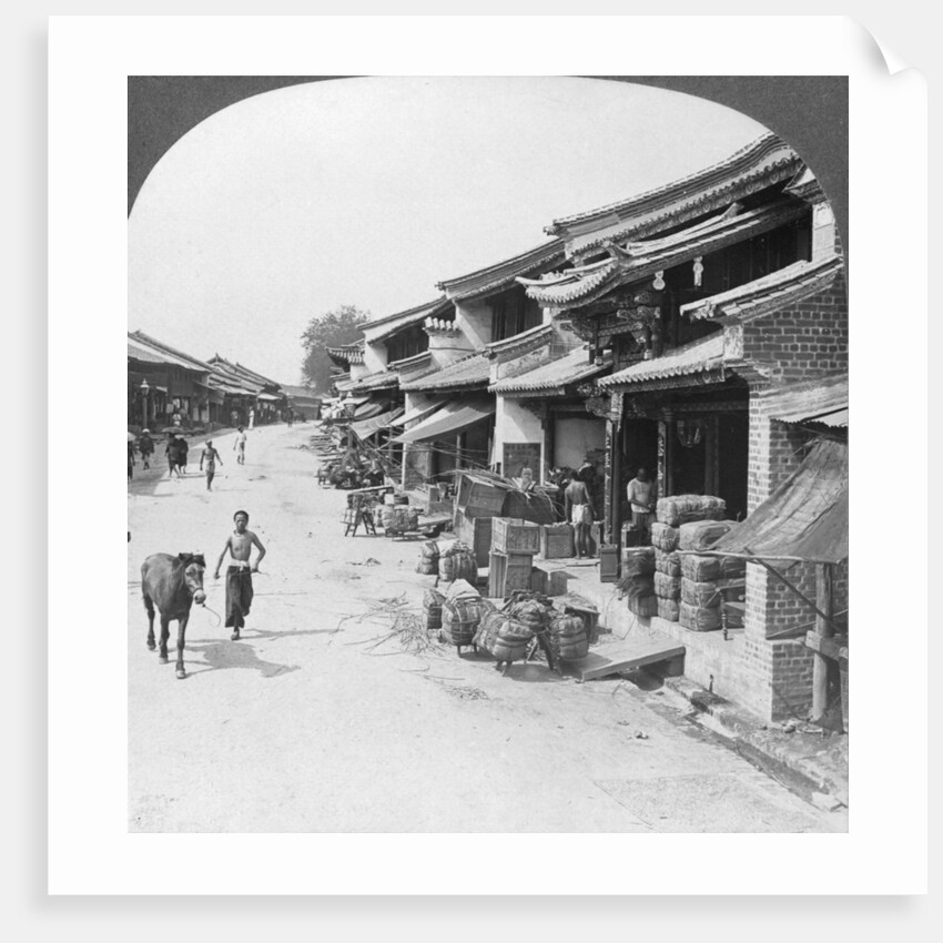 Main business street of the Chinese quarter, Bhamo, Burma by Stereo Travel Co