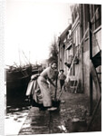 Woman mopping the street, Dordrecht, Netherlands by James Batkin