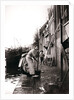 Woman mopping the street, Dordrecht, Netherlands by James Batkin