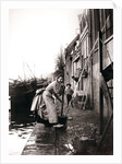 Woman mopping the street, Dordrecht, Netherlands by James Batkin