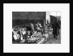 A display of goods at the flea market, Paris by Ernest Flammarion