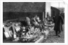 A display of goods at the flea market, Paris by Ernest Flammarion