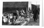 A display of goods at the flea market, Paris by Ernest Flammarion