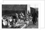 A display of goods at the flea market, Paris by Ernest Flammarion