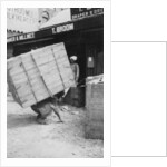 A porter lifting a large load, Chakrata, India by Anonymous