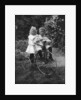 Two children on a tricycle by CW Perry