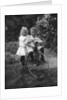 Two children on a tricycle by CW Perry