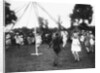 Children dancing round a maypole by Anonymous
