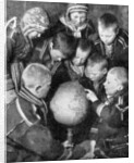 Lapp children looking at a globe by Anonymous