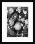 Lapp children looking at a globe by Anonymous