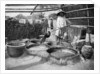 Clarifying sugar cane juce, Annam, Vietnam by Anonymous
