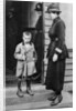 An East End child and a policewoman, London by Anonymous