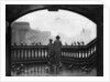 A man and a boy feeding the birds by Blackfriars Bridge, London by Anonymous