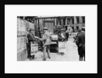 The lunchtime newspaper paper headlines, Trafalgar Square, London by Anonymous