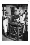 Cutting a key barrel, London by Anonymous